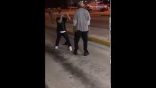 Little dude fights a big dude on the streets