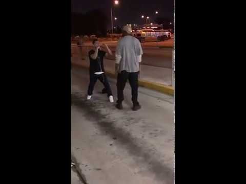 Little dude fights a big dude on the streets