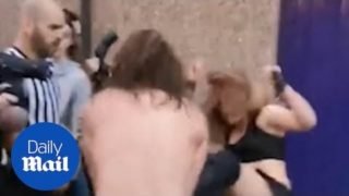 Moment professional wrestlers fight on the streets of Coventry