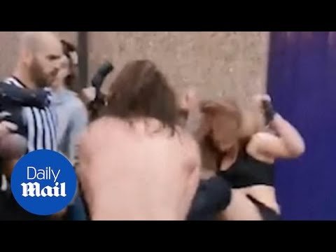 Moment professional wrestlers fight on the streets of Coventry