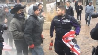 Street fight breaks out over flag burning